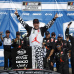 KANSAS CITY, KANSAS - MAY 15: Kurt Busch, driver of the #45 Jordan Brand Toyota, celebrates in victory lane after winning the NASCAR Cup Series AdventHealth 400 at Kansas Speedway on May 15, 2022 in Kansas City, Kansas. (Photo by Chris Graythen/Getty Images)
