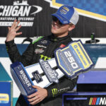 BROOKLYN, MICHIGAN - AUGUST 06: Ty Gibbs, driver of the #54 Monster Energy Toyota, celebrates in victory lane after winning the NASCAR Xfinity Series New Holland 250 at Michigan International Speedway on August 06, 2022 in Brooklyn, Michigan. (Photo by Sean Gardner/Getty Images)
